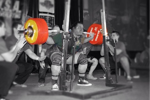 Joseph Cappellino taking 892lbs for a ride in the squat